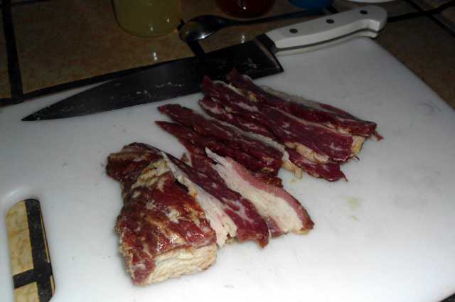 The product came in a chunks, some large, some small.  I'm not that good at slicing, so cut it maybe 1/8" thick.  If it was frozen solid or I had a slicing machine, it could probably be made thin like regular bacon.